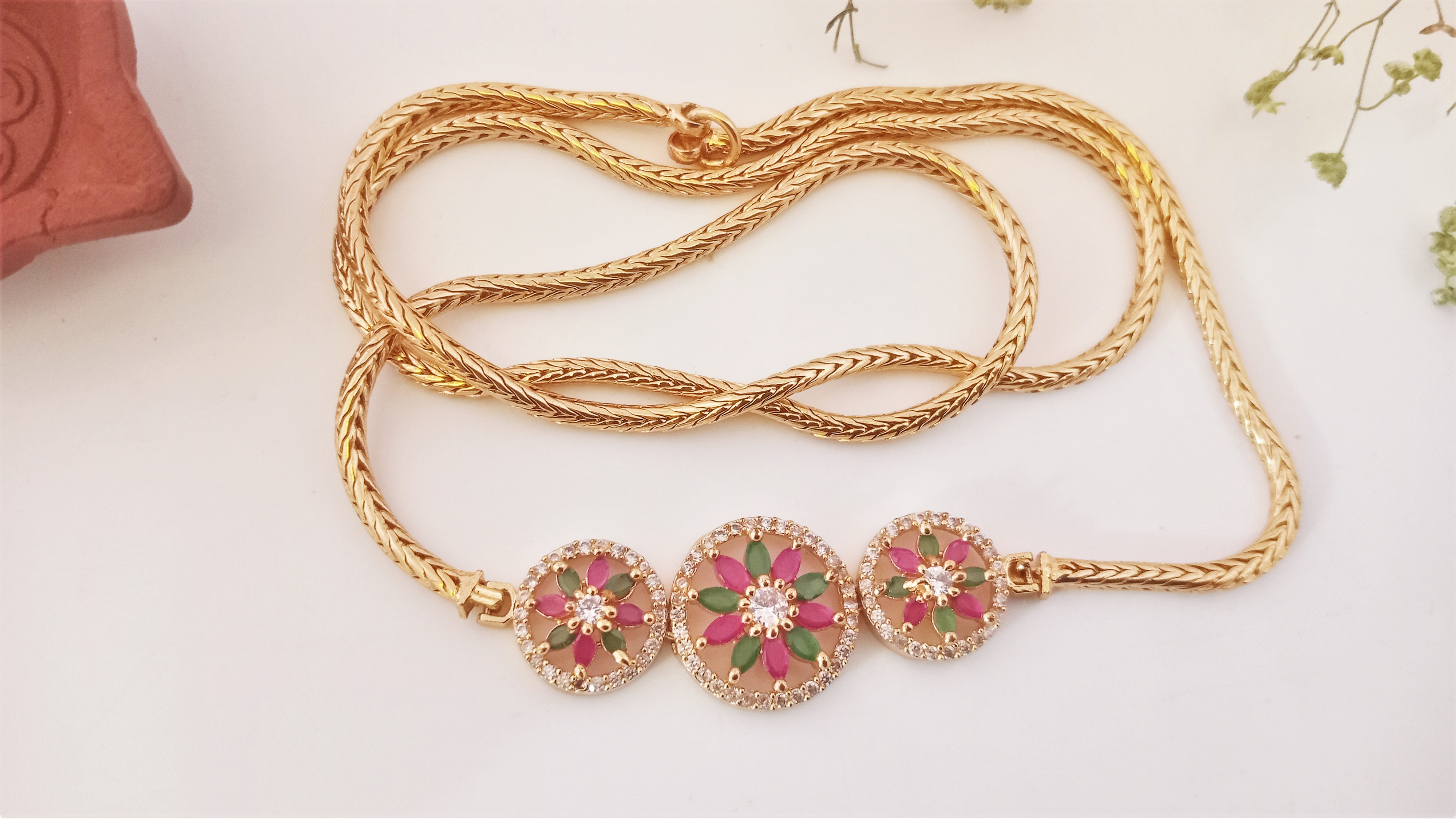 Diyas 24"(60cm) Mugappu Chain  Expertly Gold plated & adorned with stunning American Diamond Stones Green & Ruby flower